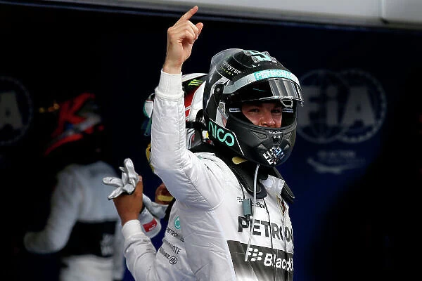 Red Bull Ring, Spielberg, Austria. Sunday 22 June 2014. Nico Rosberg, Mercedes AMG, 1st Position, celebrates in Parc Ferme. World Copyright: Glenn Dunbar / LAT Photographic. ref: Digital Image _W2Q2075