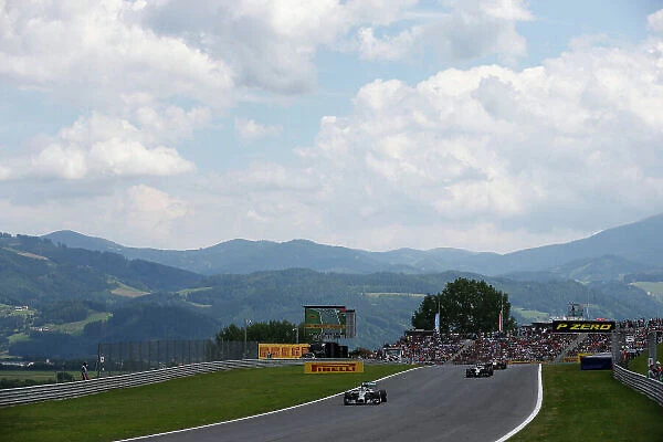 Red Bull Ring, Spielberg, Austria. Sunday 22 June 2014. Lewis Hamilton, Mercedes F1 W05 Hybrid, leads Kevin Magnussen, McLaren MP4-29 Mercedes, and Sergio Perez