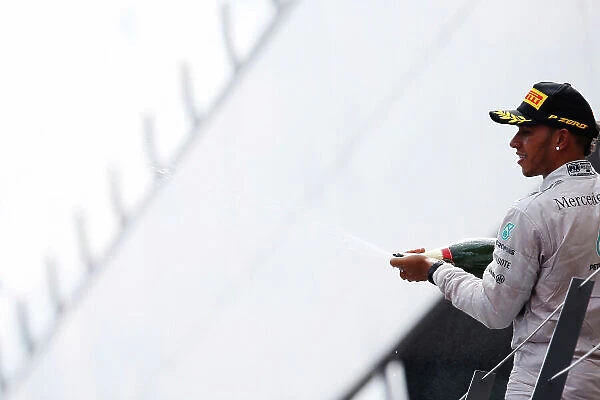 Red Bull Ring, Spielberg, Austria. Sunday 22 June 2014. Lewis Hamilton, Mercedes AMG, celebrates second place on the podium. World Copyright: Charles Coates / LAT Photographic. ref: Digital Image _J5R1830