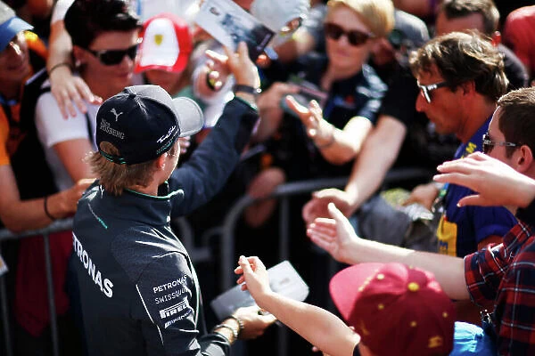 Red Bull Ring, Spielberg, Austria. Saturday 21 June 2014. Nico Rosberg, Mercedes AMG, signs autographs for fans. World Copyright: Charles Coates / LAT Photographic. ref: Digital Image _N7T3563
