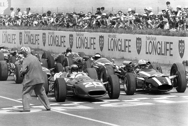 Reims, France. 3 July 1966: Lorenzo Bandini, Ferrari 312, not classified, and John Surtees, Cooper T81-Maserati, retired, on the front row before the start