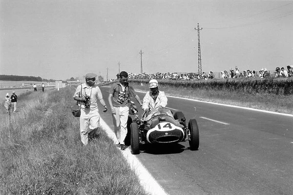 Reims, France. 5 July 1959: Maurice Trintignant, Cooper T51-Climax, 11th position. On the left is photographer Bernard Cahier, portrait, action