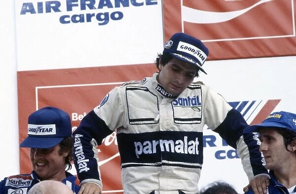 Rio de Janeiro, Brazil. 19-21 March 1982: Nelson Piquet rests on Keke Rosberg and Alain Prost on the podium