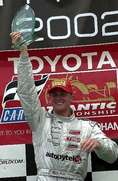 Ryan Hunter-Reay with the winners trophy at the toyota Atlantic race at the CART Grand Prix of Chicago. Chicago Motor Speedway, Chicago, Il. 06