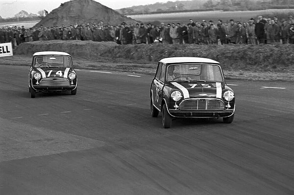 Saloon Car Racing: Racing Minis battle for position: Saloon Car Racing, Goodwood, England 1962