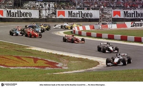 SE Brazil GP 6. Mika Hakkinen leads at the start of the Brazilian Grand Prix..