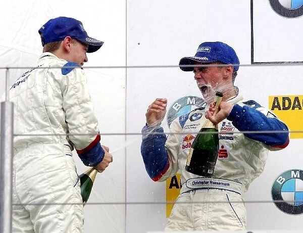 Second place Sebastian Vettel (GER), Eifelland Racing, left, spraying champagne in the face of race winner Christopher Wassermann (AUT), Josef