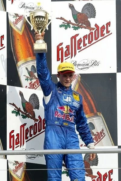 DTM. Second placed Mattias Ekstrom (SWE), PlayStation 2 Red Bull Abt-Audi, on the podium.