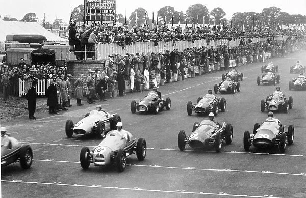 Silverstone, Great Britain. 17 July 1954: With the leaders gone Clemar Bucci, Gordini 16 #18, retired, B Bira, Maserati 250F #6, retired