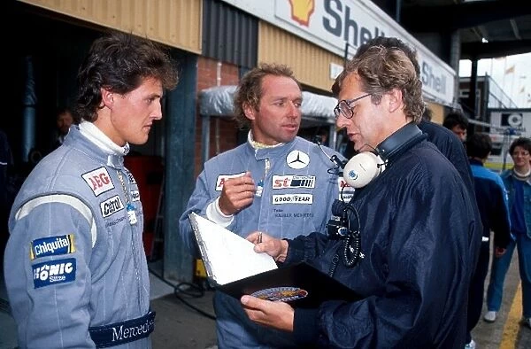 Sportscar World Championship: Michael Schumacher and Jochen Mass discuss their disqualification from the meeting during qualifying with an official