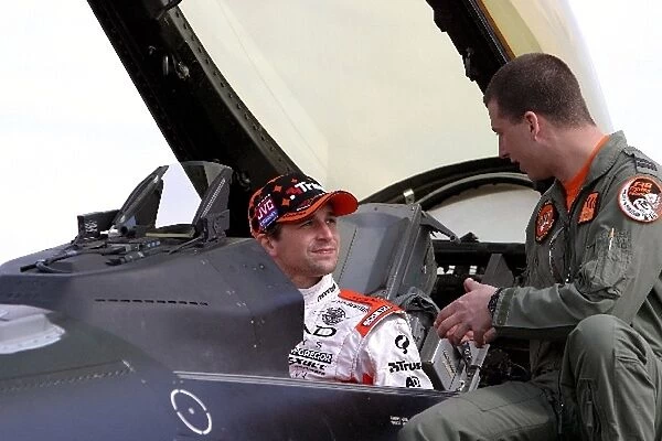 Spyker vs F-16 Jet Fighter: Chrisitjan Albers, Spyker, is briefed on the cockpit controls of a General Dynamics F-16 jet fighter