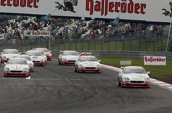 Start of the race, Edi Gay (ITA)  /  Diego Alessi (ITA), Maserati 3200 GT Coup Cambiocorsa, leading the field into the first corner. Trofeo Maserati, Rd 3, Nrburgring, Germany. 25 May 2003. DIGITAL IMAGE