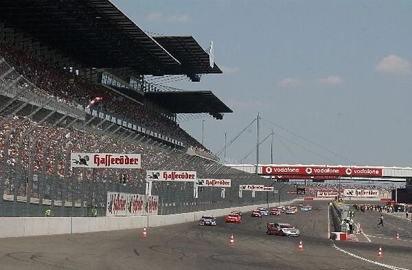 Start of the warm-up  /  formation lap, in front of a packed grandstand. DTM Championship