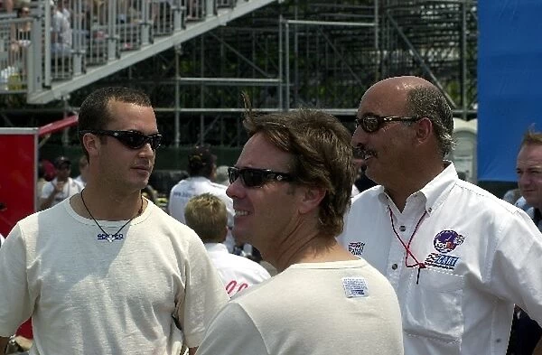 Teammates Jimmy Vasser and Michel Jourdain get advice from team owner Bobby Rahal prior to qualifying for the Molson Indy Toronto. Exhibition Place, Toronto, Ont. Ca. 06