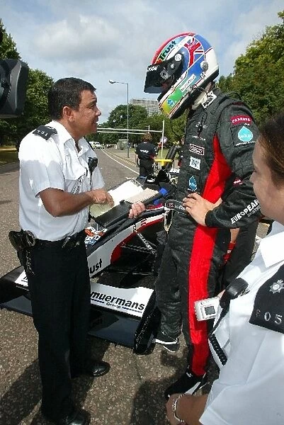 Thunder In Hyde Park: Justin Wilson, Minardi, is given a speeding ticket by the police