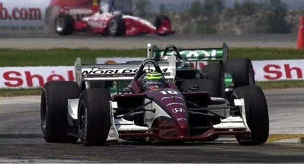 Tony Kanaan, (BRZ), Honda  /  Lola, led Paul Tracy early, but faded to eighth at the finish of the Marconi Grand Prix of Cleveland. Burke Lakefront Airport, Cleveland, Ohio. 14