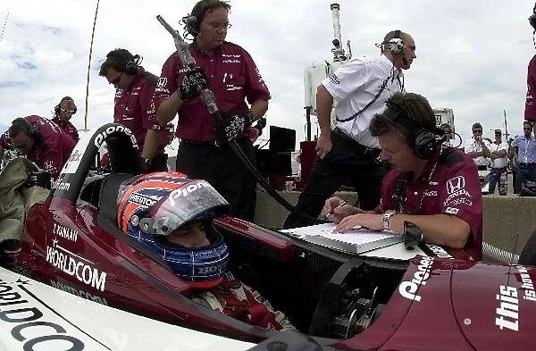 Tony Kanaan talks to his engineer during practice for the Miller Lite 250