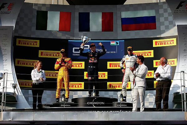 Ts-live. Pierre Gasly (FRA, PREMA, Racing) lifts the trophy on the podium.