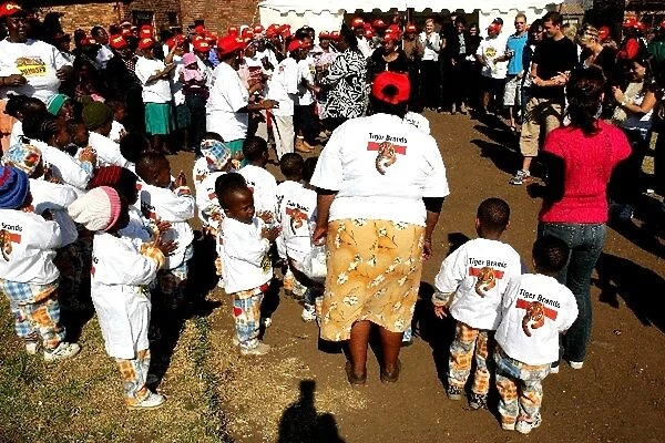 Unite Against Hunger: Dannii Minogue joins in a dance with children at a school in Soweto which is being helped by Unite Againts Hunger