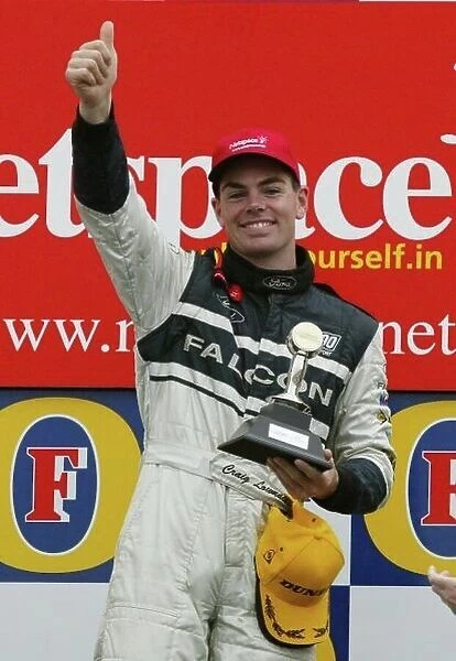V8 Supercar 2002 AGP : Ford driver Craig Lowndes on the Podium after winning the third and final race for the V8 Supercars at the 2002 Fosters Australian GP