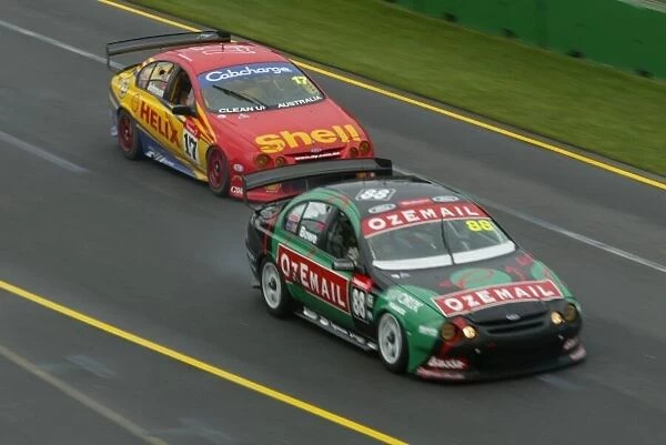 V8 Supercar 2002 AGP : Ford Falcon driver John Bowe leads Paul Radisich during race 3 of