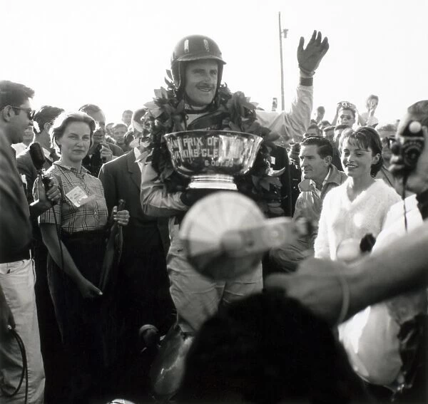 Watkins Glen, New York, USA. 4-6 October 1963: Graham Hill celebrates his 1st position on the podium, portrait