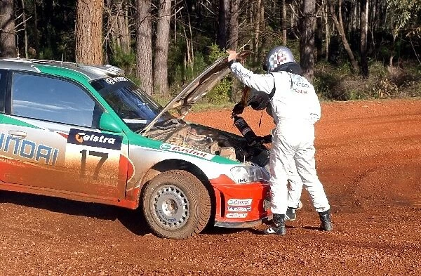 World Rally Championship: Armin Schwarz Hyundai Accent WRC extinguishes a small fire on stage 7, and retired with a failed engine