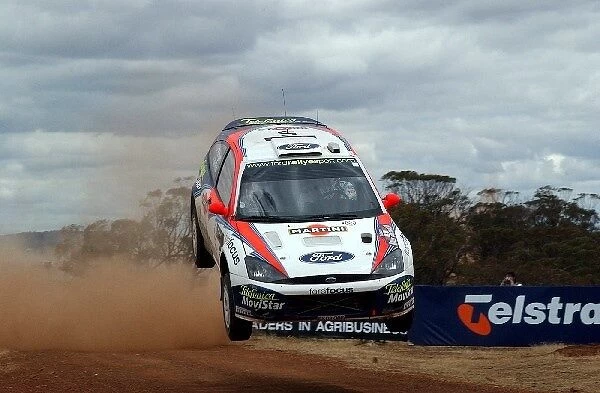 World Rally Championship: Colin McRae  /  Derek Ringer Ford Focus RS WRC 02, flies over the cattle grid at high speed and lands heavily on the