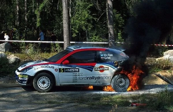 World Rally Championship: Colin McRae had to evacuate his Ford Focus RS WRC after a loose hydraulic line caught fire at the end of stage 20