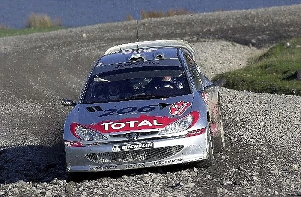 World Rally Championship: Juuso Pykalisto with co-driver Esko Mertsalmi Peugeot 206 WRC in action on Stage 4, Rheola