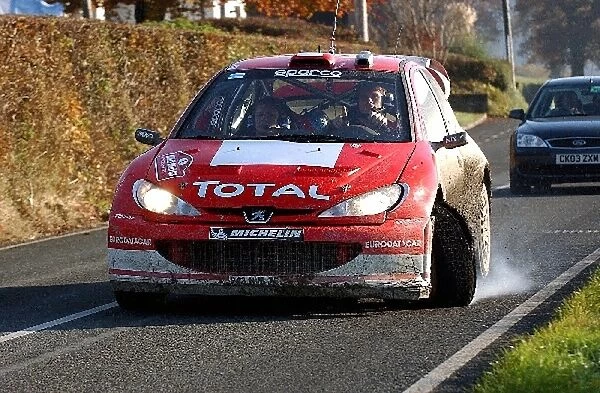 World Rally Championship: Marcus Gronholm with co-driver Timo Rautiainen Peugeot 206 WRC attempts to get back to service after an off on stage three