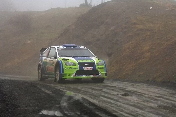 World Rally Championship: Marcus Gronholm Ford Focus WRC drives through Stage 1 which was cancelled due to the bad weather conditions