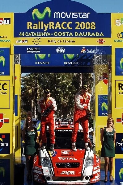 World Rally Championship: Martin Prokop and Jan Tomanek, Citroen C2 Super 1600, celebrate winning the JWRC category with champagne on the podium