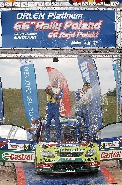 World Rally Championship: R-L: Ford team mates Mikko Hirvonen and Jarmo Lehtinen celebrate their victory