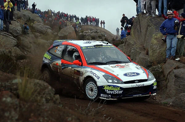 World Rally Championship, Rally of Argentina, May 16-19, 2002. Carlos Sainz drives through the rocks and spectators on stage 20. Photo: Ralph Hardwick / LAT