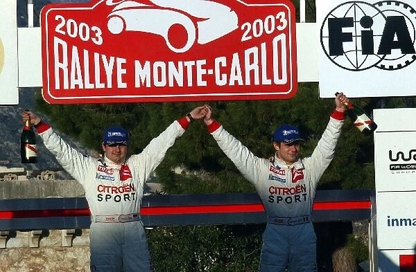 World Rally Championship: Rally winners Daniel Elena and Sebastien Loeb Citroen Xsara WRC on the finish ramp