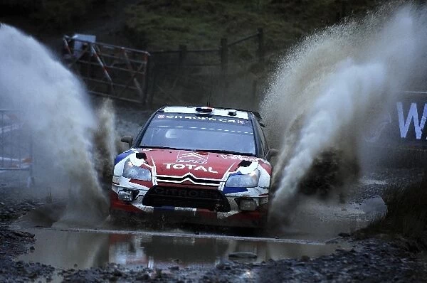 World Rally Championship: Sebastien Ogier Citroen C4 WRC in the watersplash on Stage 5, Sweet Lamb