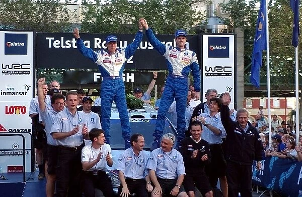 World Rally Championship: Timo Rautianen and Marcus Gronholm celebrate victory on the podium