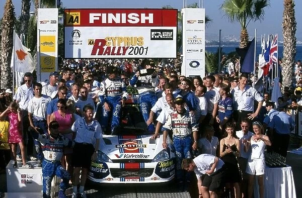 World Rally Championship: Winners Colin McRae and Nicky Grist celebrate with the Ford team