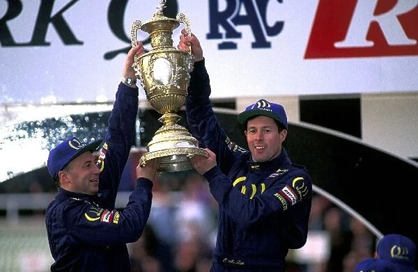 World Rally Championship: World Rally Champions for Subaru Derek Ringer and Colin McRae celebrate on the podium