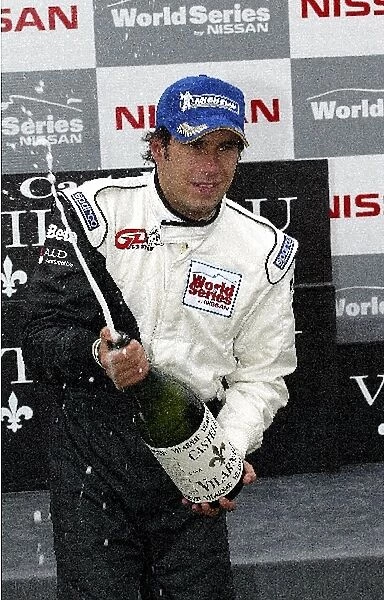World Series By Nissan: Enrique Bernoldi, Team GD Racing, sprays champagne on the podium after winning both races