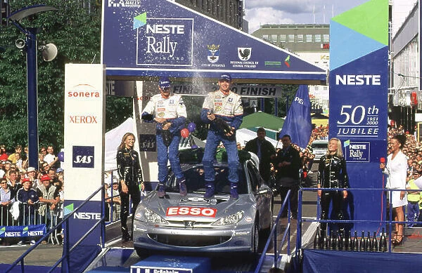 WRC Neste Rally of Finland 2000 17th - 20th August 2000. Rd 9 / 13. Rally winner Marcus Gronholm, Peugeot, podium. Photo:McKlein / LAT Ref 35mm A16