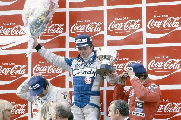 Zolder, Belgium. 2-4 May 1980: Didier Pironi, 1st position on the podium, with Alan Jones, 2nd position, and Carlos Reutemann, 3rd position