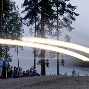 1000 Lakes, Finland. 23rd - 26th August 1990: Fans watch on as a rally car speeds past. Action