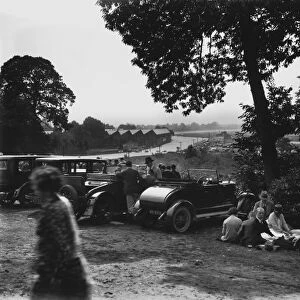 1928 August Bank Holiday Meeting: Cars line up in front of the Vickers sheds as the crowd enjoys a picnic