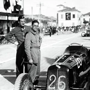 1935 Coppa Acerbo Junior voiturette race. Pescara, Italy. 15 August 1935. Dick Seaman, ERA B-type, 1st position, stands with his mechanic Jock Finlayson, before the start, portrait. World Copyright: Robert Fellowes/LAT Photographic Ref: 35CA12
