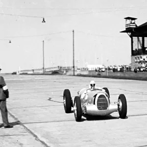 1937 Eifelrennen. Nurburgring, Germany. 13 June 1937. Bernd Rosemeyer, Auto Union C, 1st position, returns to the pits after setting pole position. Alfred Neubauer, Mercedes-Benz Team Manager, stands to the left