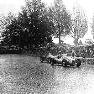 1951 Swiss Grand Prix: Juan Manuel Fangio prepares to pass Louis Chiron. They finished in 1st and 7th positions respectively