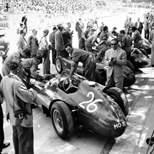 1956 Monaco Grand Prix: Peter Collins / Juan Manuel Fangio, Lancia-Ferrari D50, 2nd position, in the pits, atmosphere