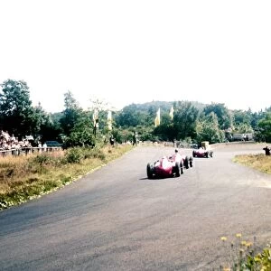 1957 German Grand Prix: Juan Manuel Fangio between Mike Hawthorn and Peter Collins. They finished in 1st, 2nd and 3rd positions respectively